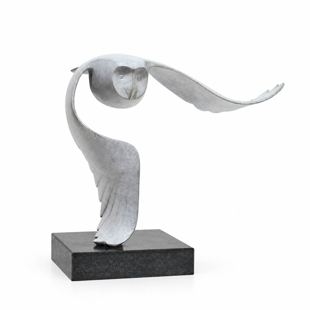 Silent Flight — bronze sculpture on a stone base